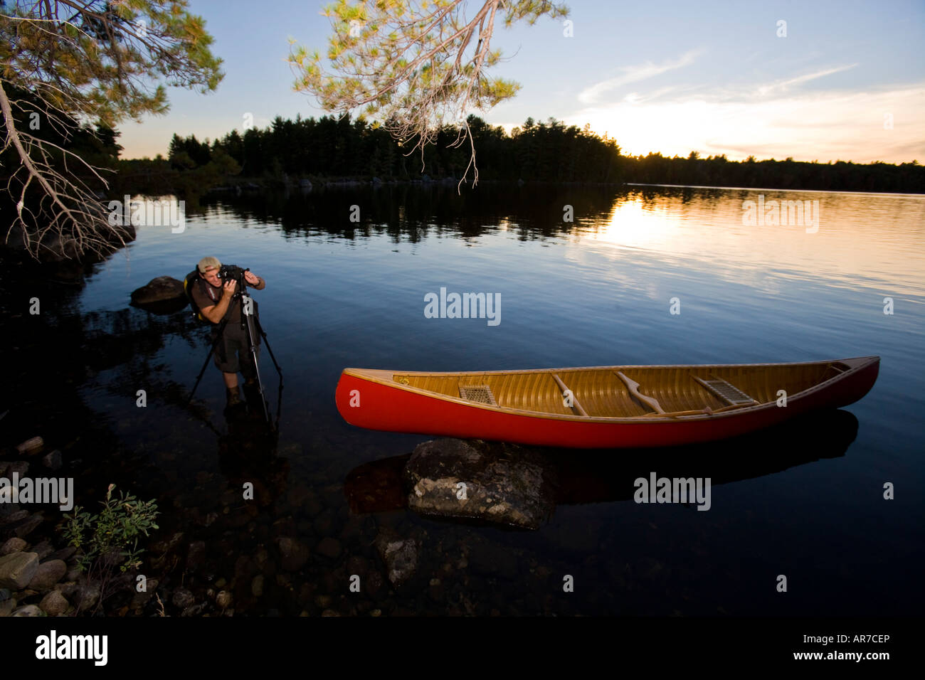A photographer on Seboeis Lake near Millinocket, Maine. Stock Photo