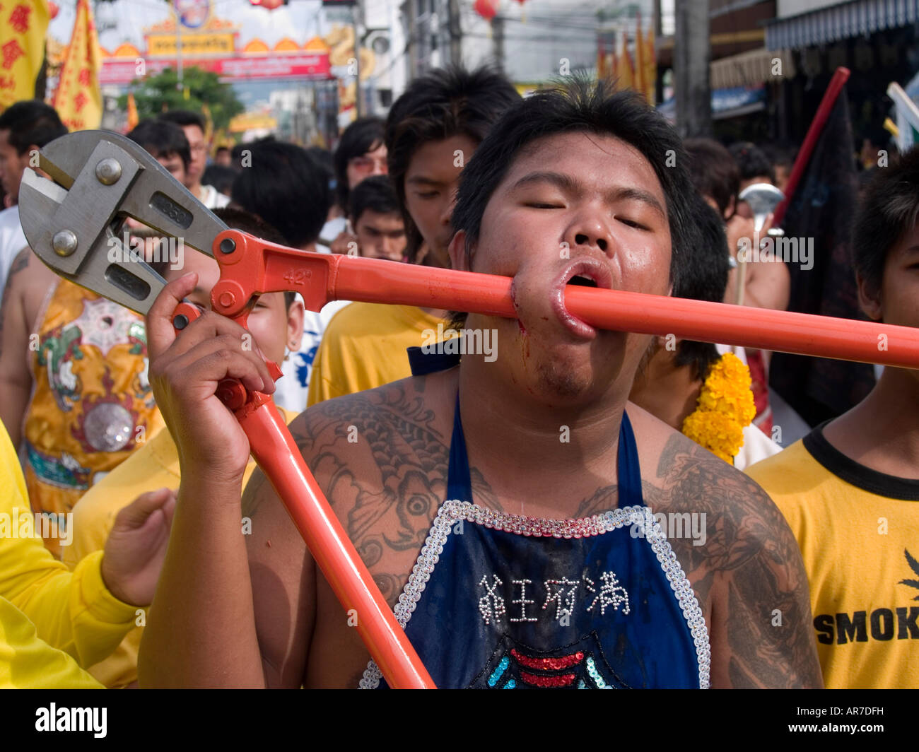 Unbelievable Large cutters through the face at the bizarre Vegetarian Festival Phuket Thailand