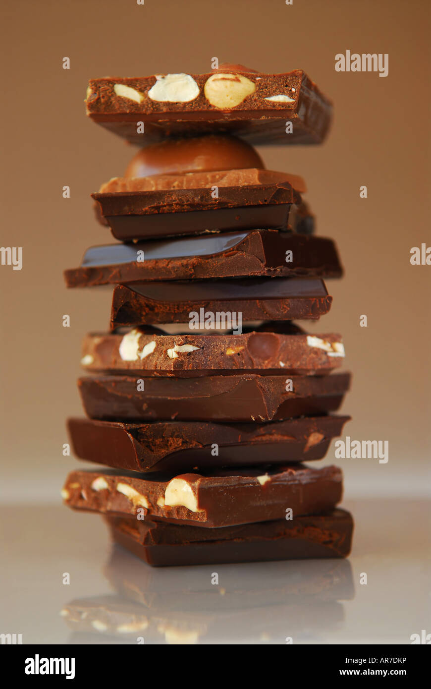 Stack of broken pieces of chocolate from assorted bars Stock Photo