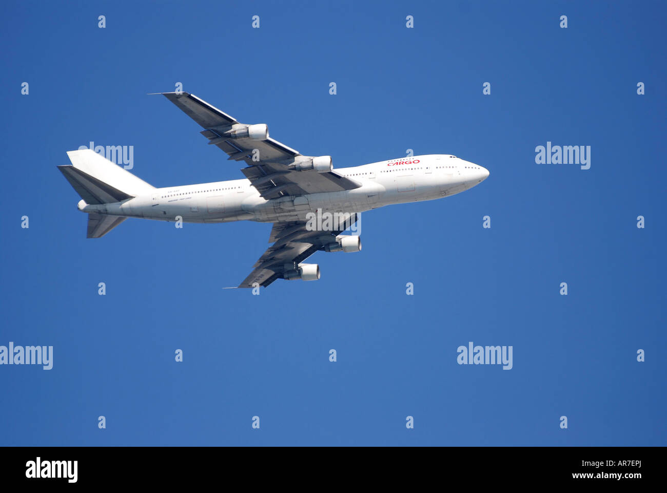 Boeing 747 200 Commercial airline jet with a blue sky background Stock Photo