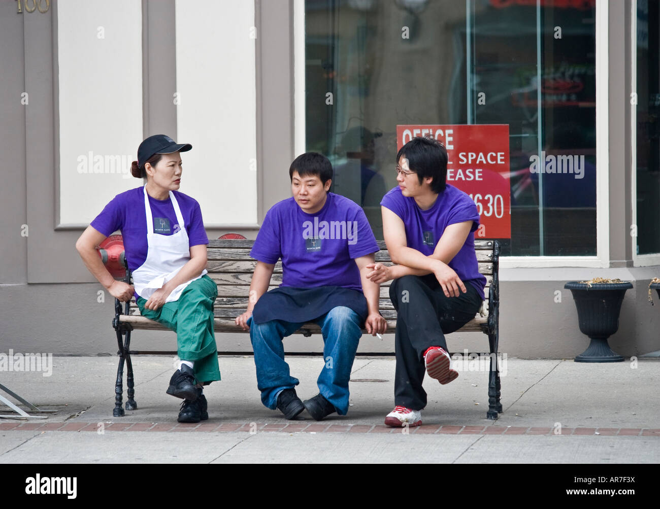 Three Asian restaurant workers on a break Toronto Canada Stock Photo