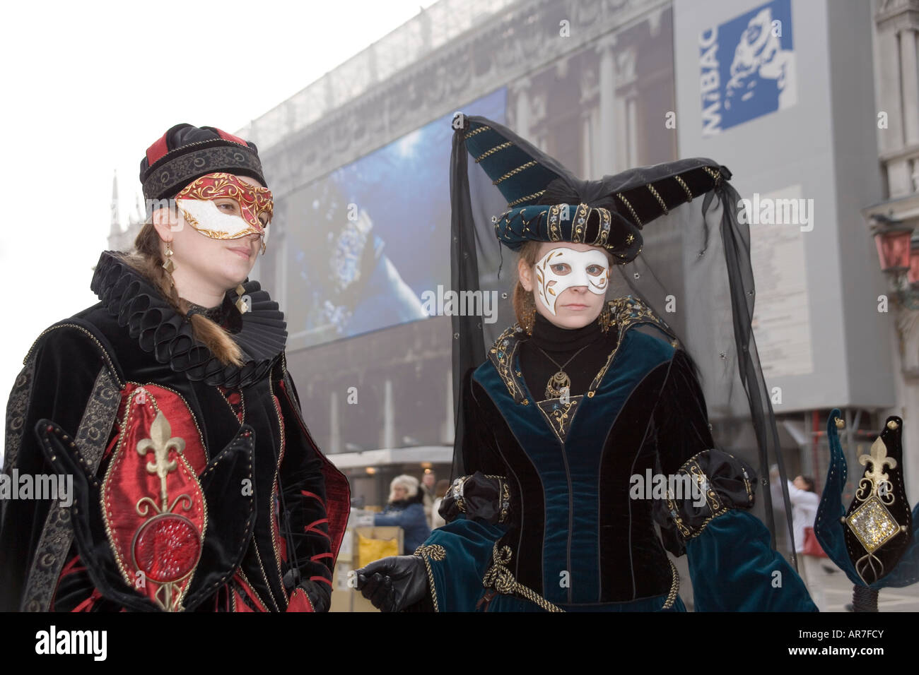 Revellers in mask and costume at the Carnival in St Mark's Square ...