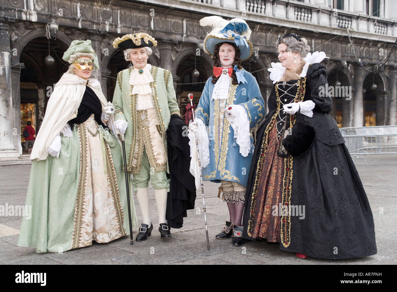 Revellers in mask and costume at the Carnival in St Mark's Square ...