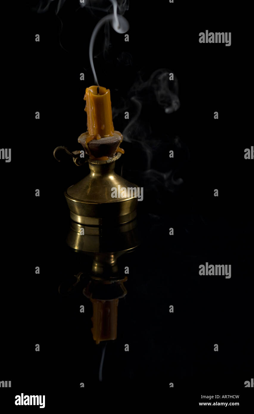 Brass candle holder with smoke Stock Photo Alamy