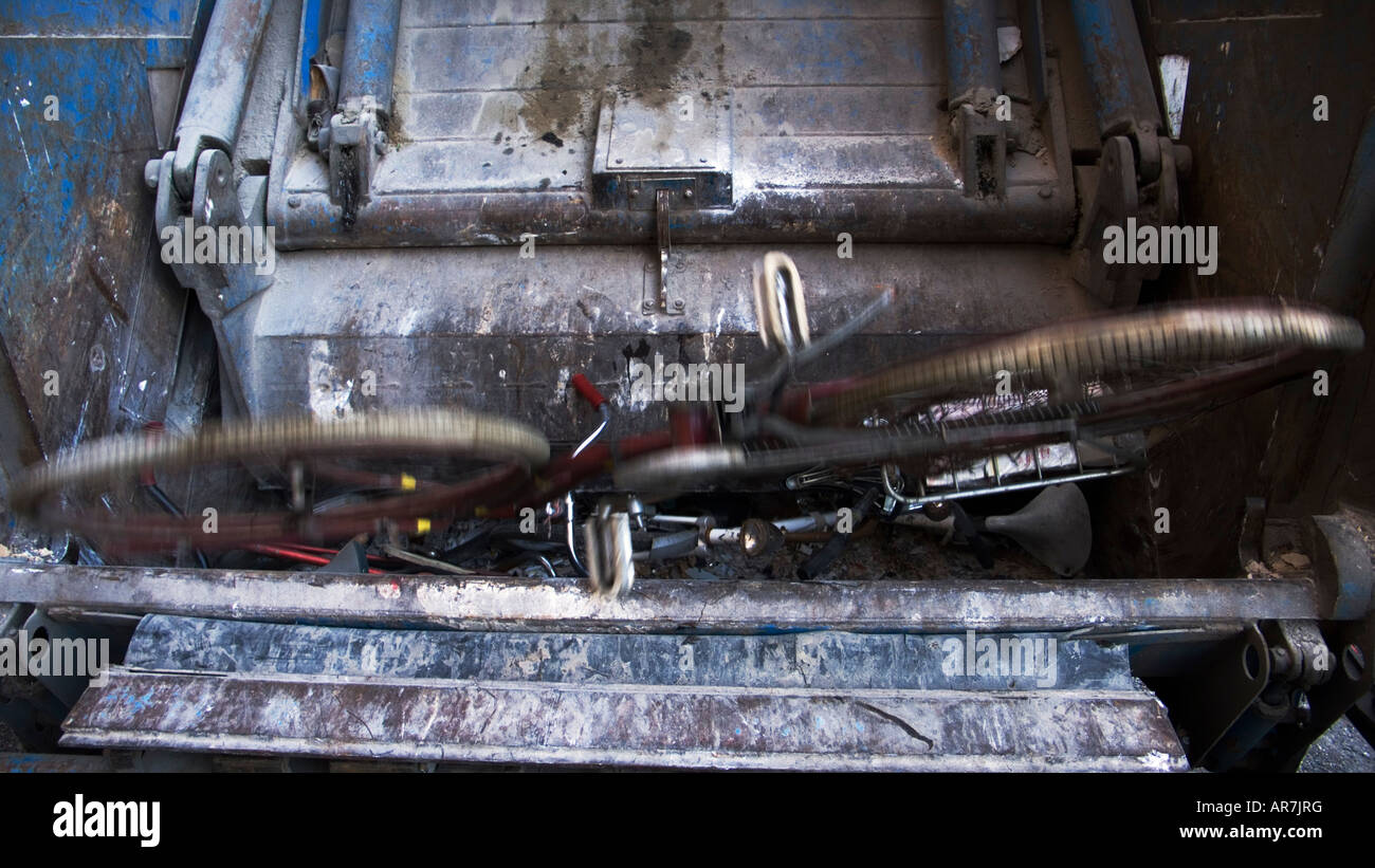Garbage Truck crush an old bicycle Stock Photo Alamy