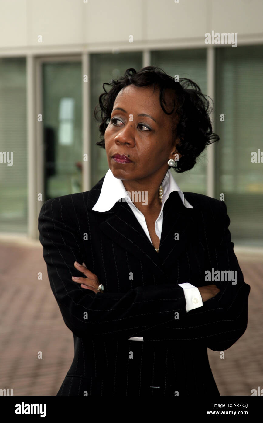 African American business woman with arms folded Stock Photo - Alamy