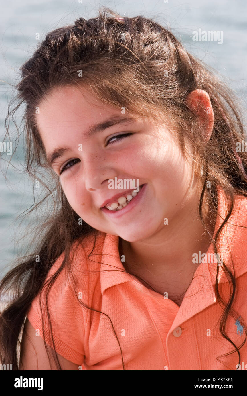 head and shoulders portrait of young girl by the water Stock Photo - Alamy
