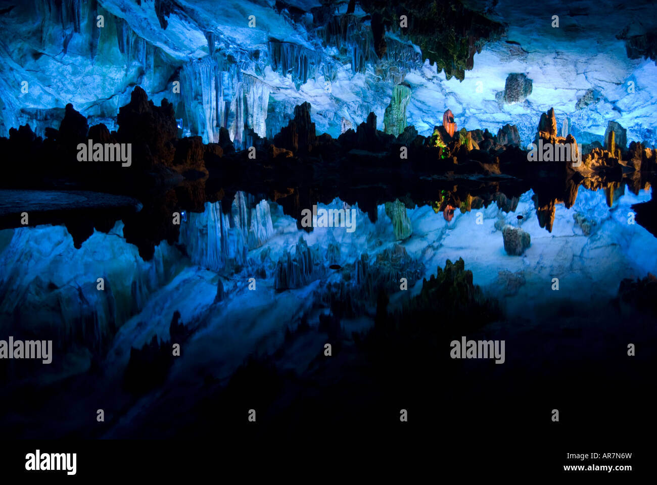 Stalactites, Stalagmites and a limestone cityscape inside the reed flute cave, Guilin, China Stock Photo
