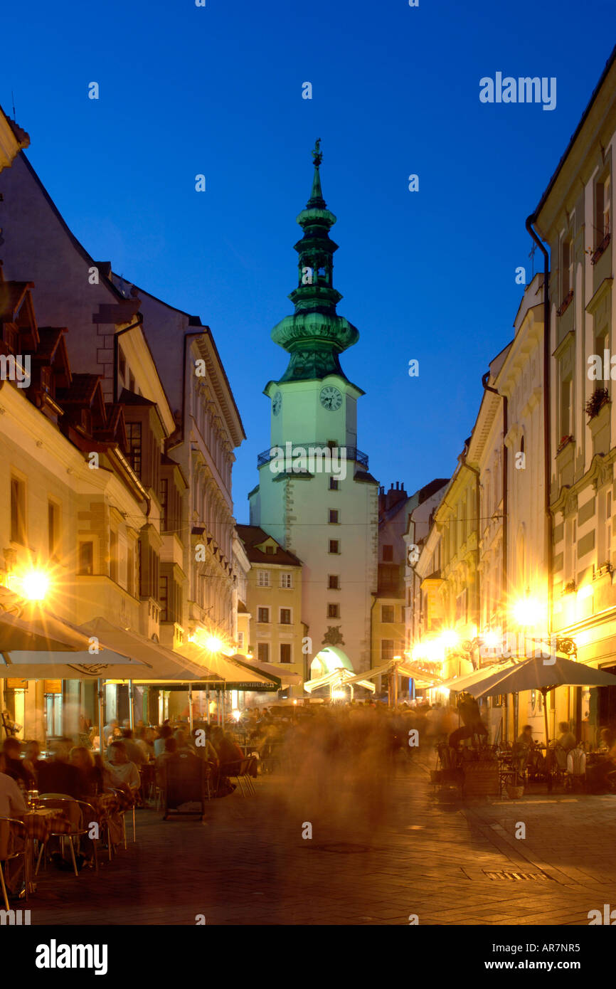 Dusk view of St Michael's Tower and sidewalk cafes in the old town of Bratislava, the capital of Slovakia. Stock Photo