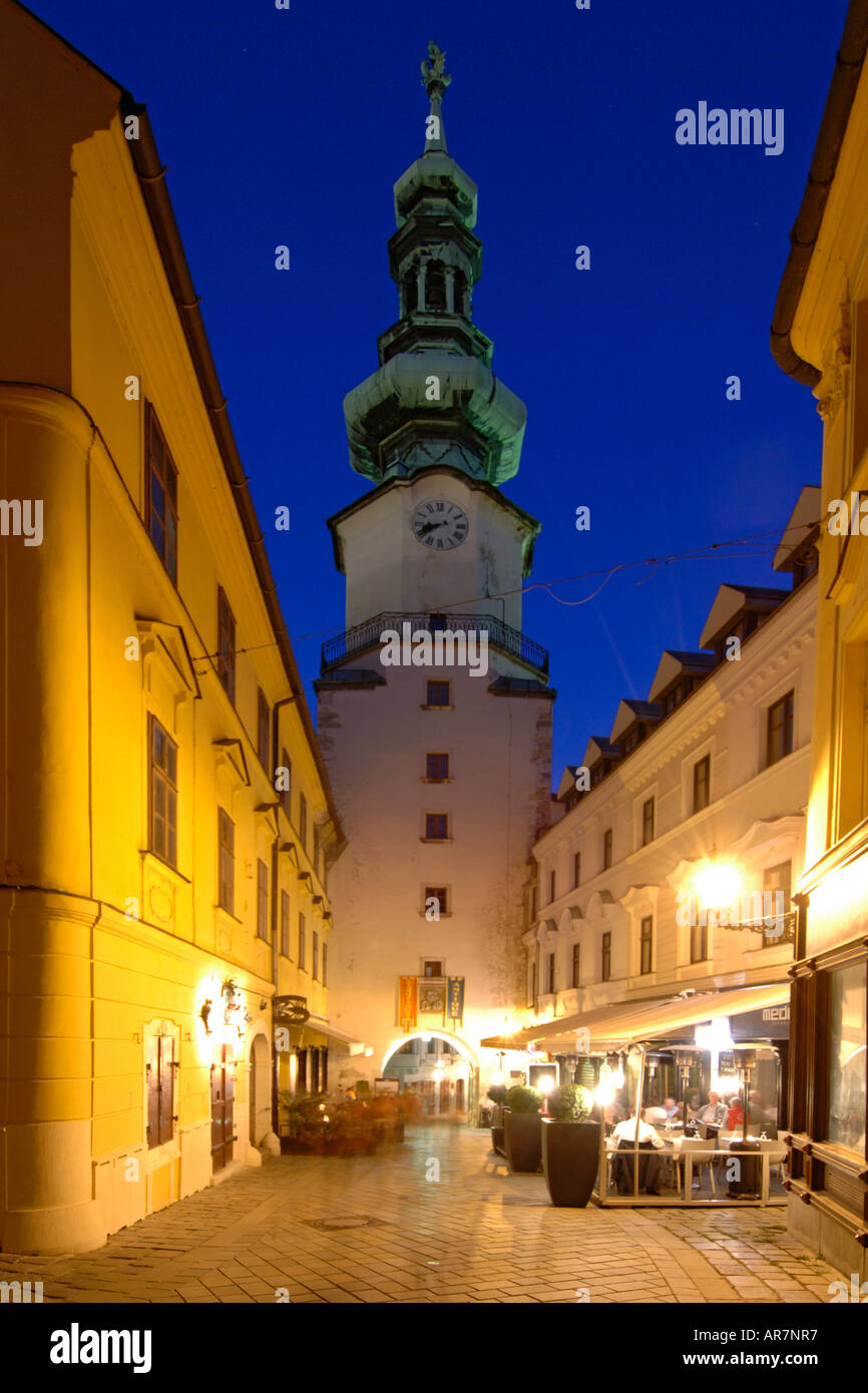 Dusk view of St Michael's Tower and sidewalk cafes in the old town of Bratislava, the capital of Slovakia. Stock Photo