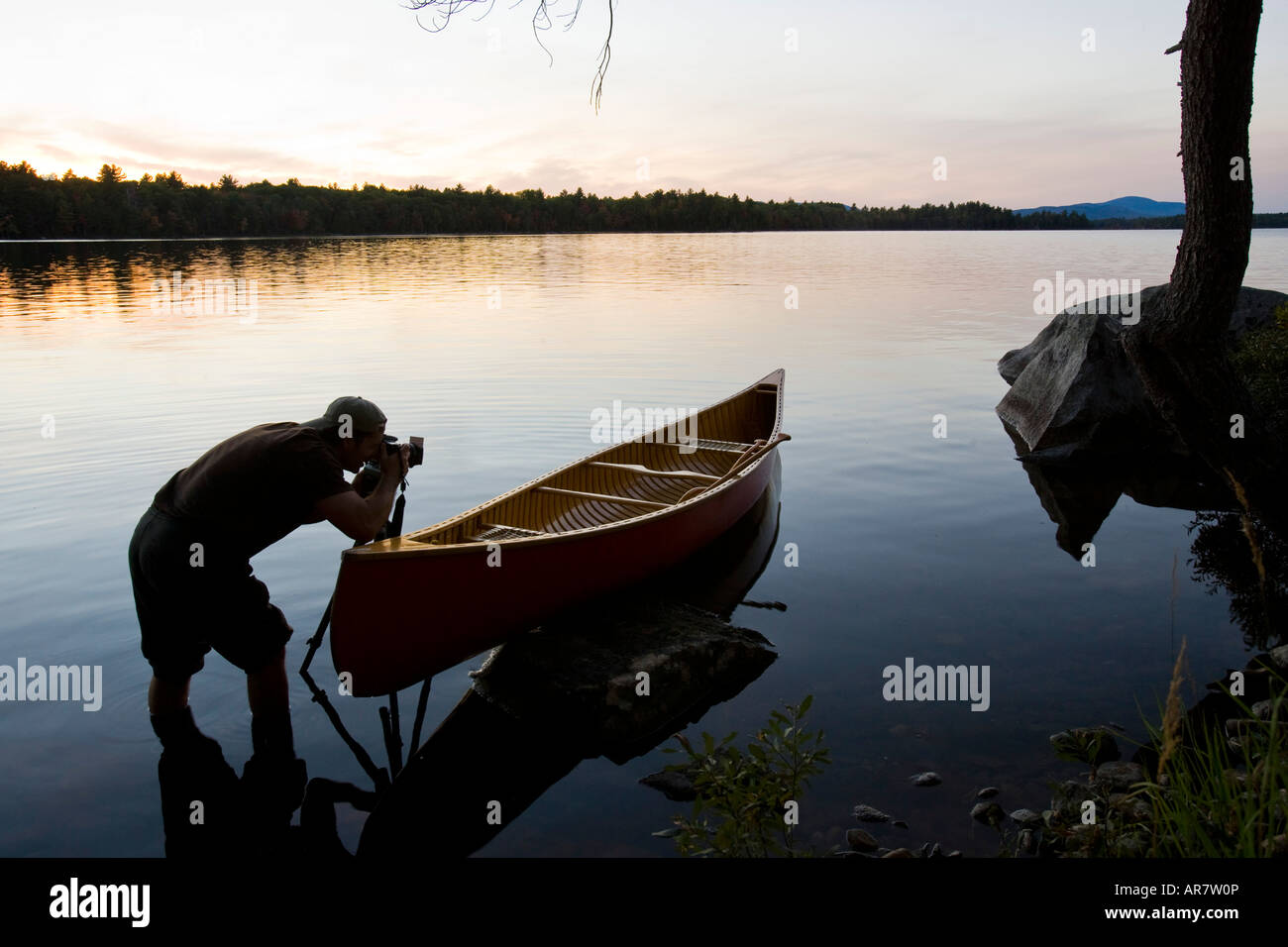 A photographer on Seboeis Lake near Millinocket, Maine. Stock Photo