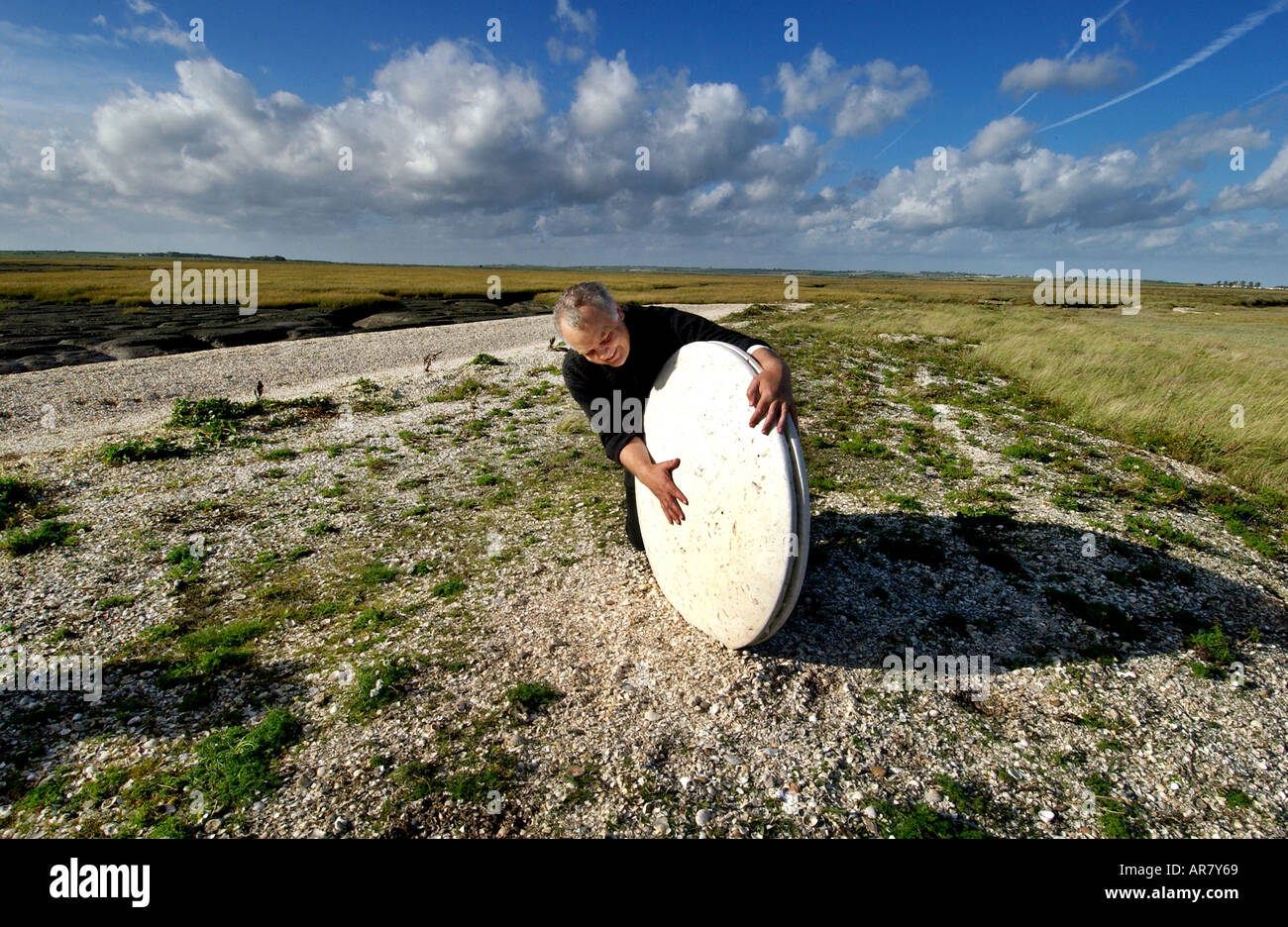 Artist Stephen Turner with concrete sculpture on Isle of Sheppey Stock