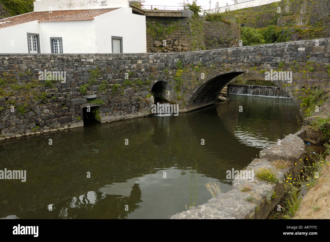 Grande River with bridge and old mill Ribeira Grande Ponta Delgada S Miguel Açores Azores Portugal Stock Photo