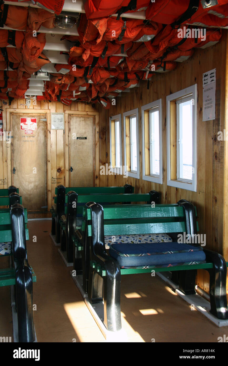 Interior of a small boat, Ladies room and Engine room doors at back. Stock Photo