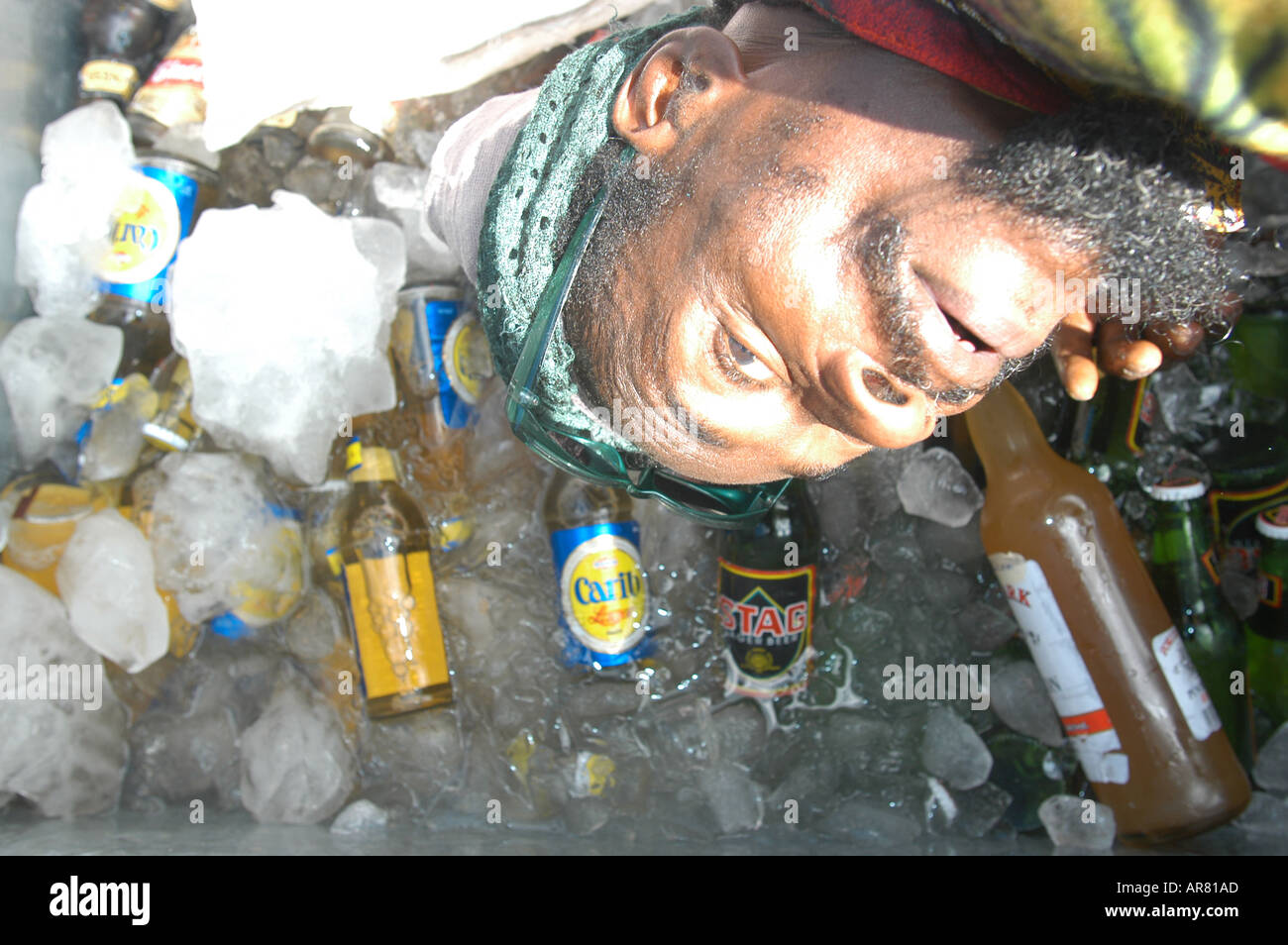 Man selling cold drinks, carnival street scene, Trinidad Stock Photo