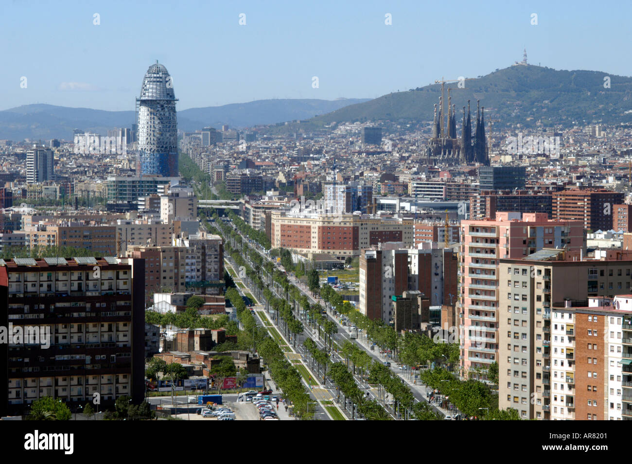 Spain, Barcelona. Avinguda Diagonal crosses city Here it leads to newly developed area and the Forum. Sagrada Familia on right Stock Photo