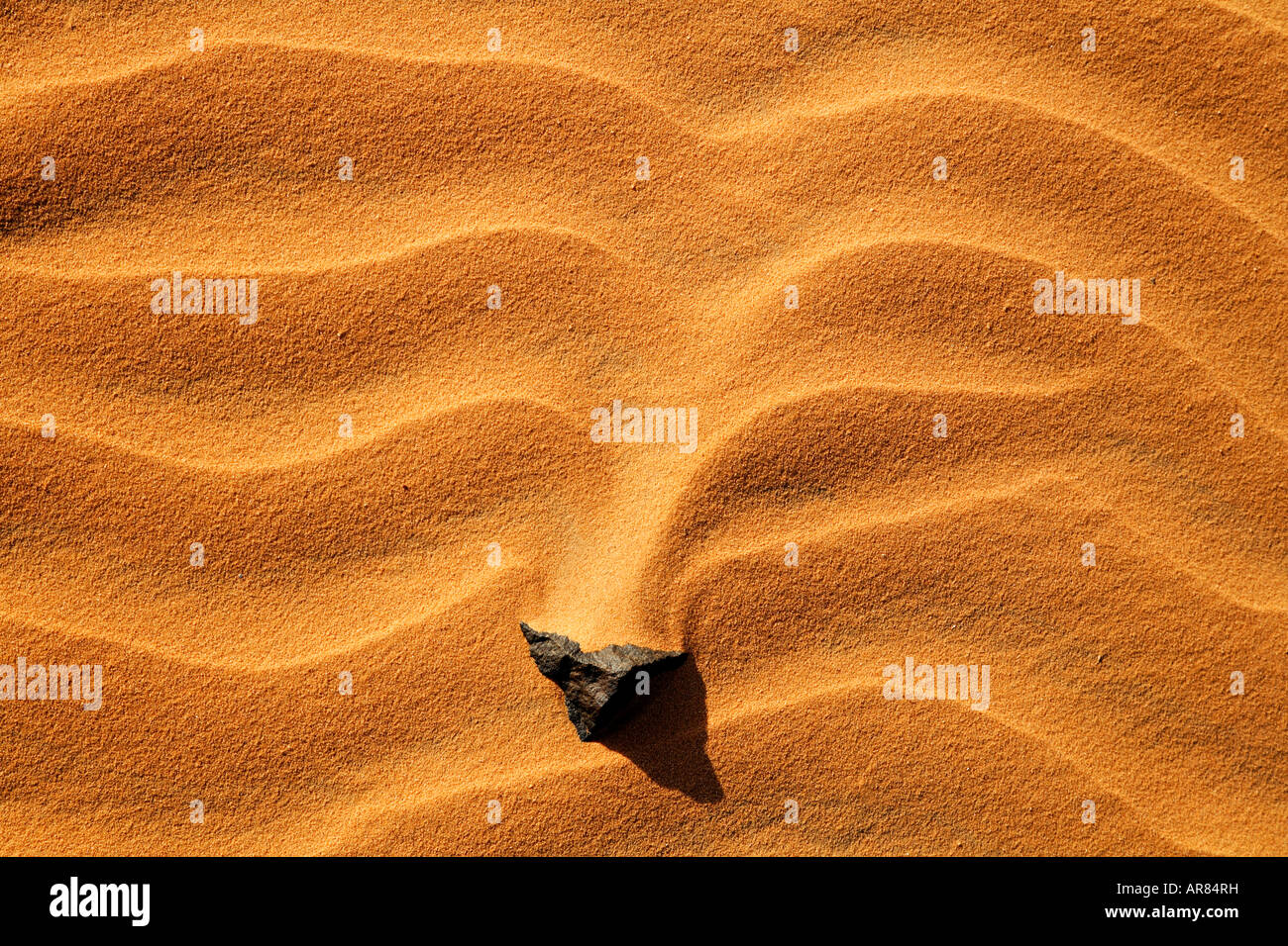 Rock in the sand Sahara Desert Libya Stock Photo