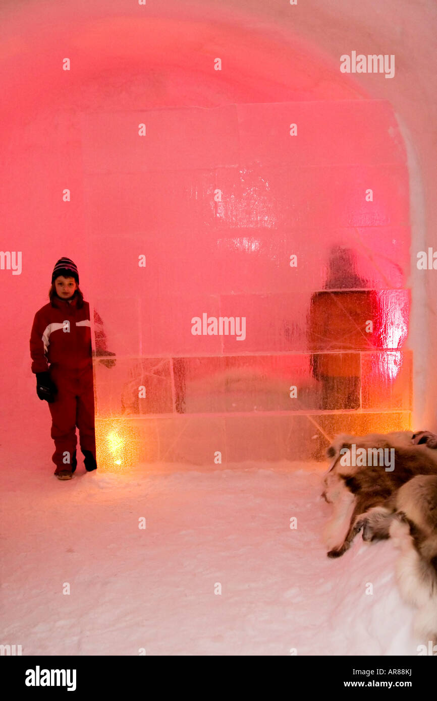Children behind a wall made of ice at an ice hotel in Norway Stock Photo