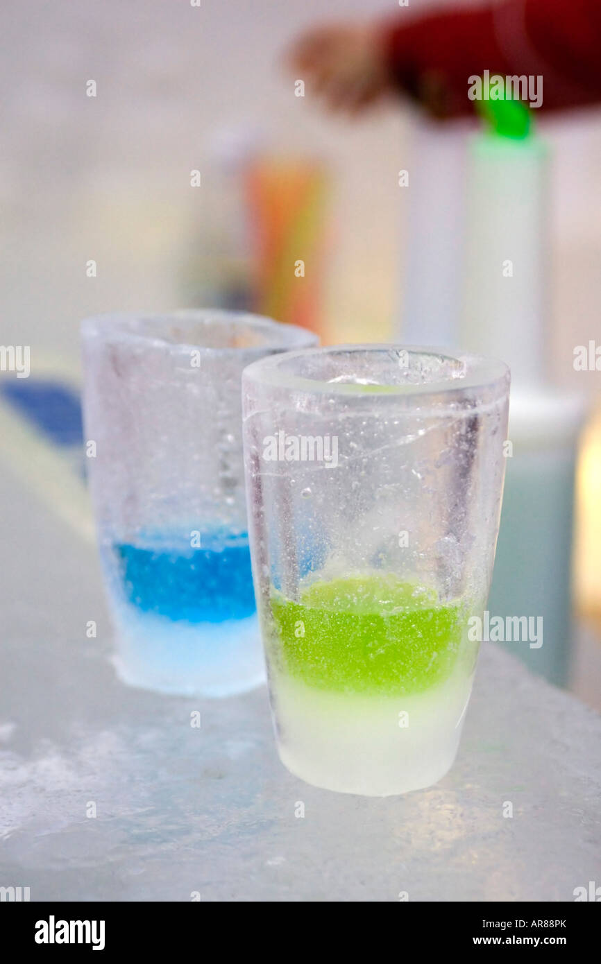 Coloured vodka in drinks shot glasses made of ice in an ice bar in Norway Stock Photo