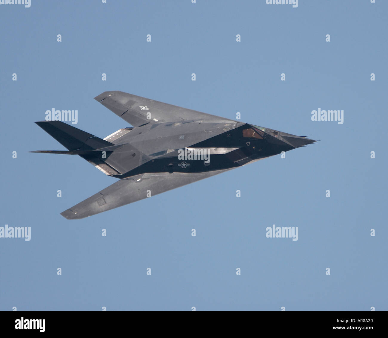 An F-117 Nighthawk fighter flying Stock Photo