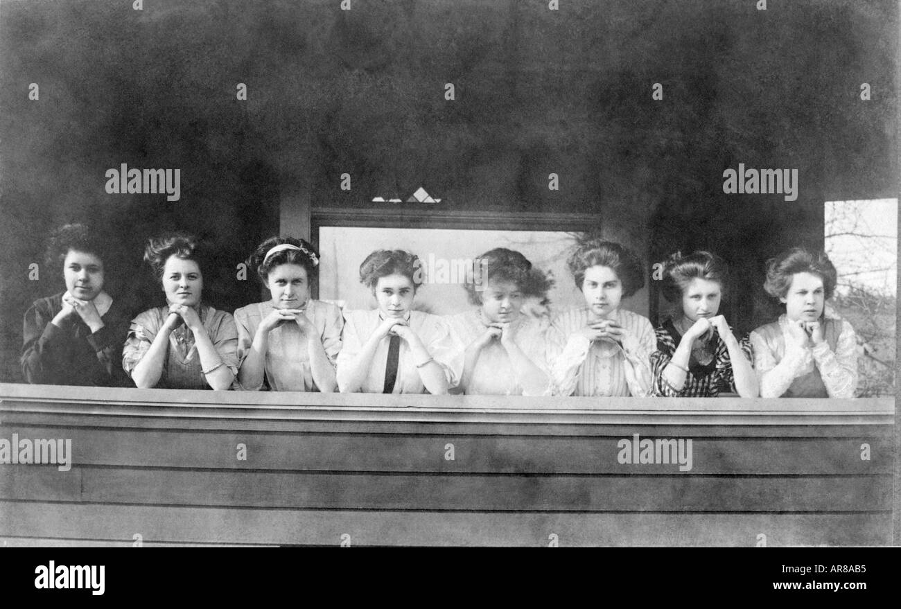 Vintage Photo of Row Of Women With Hands Clasped Under Chins Stock Photo