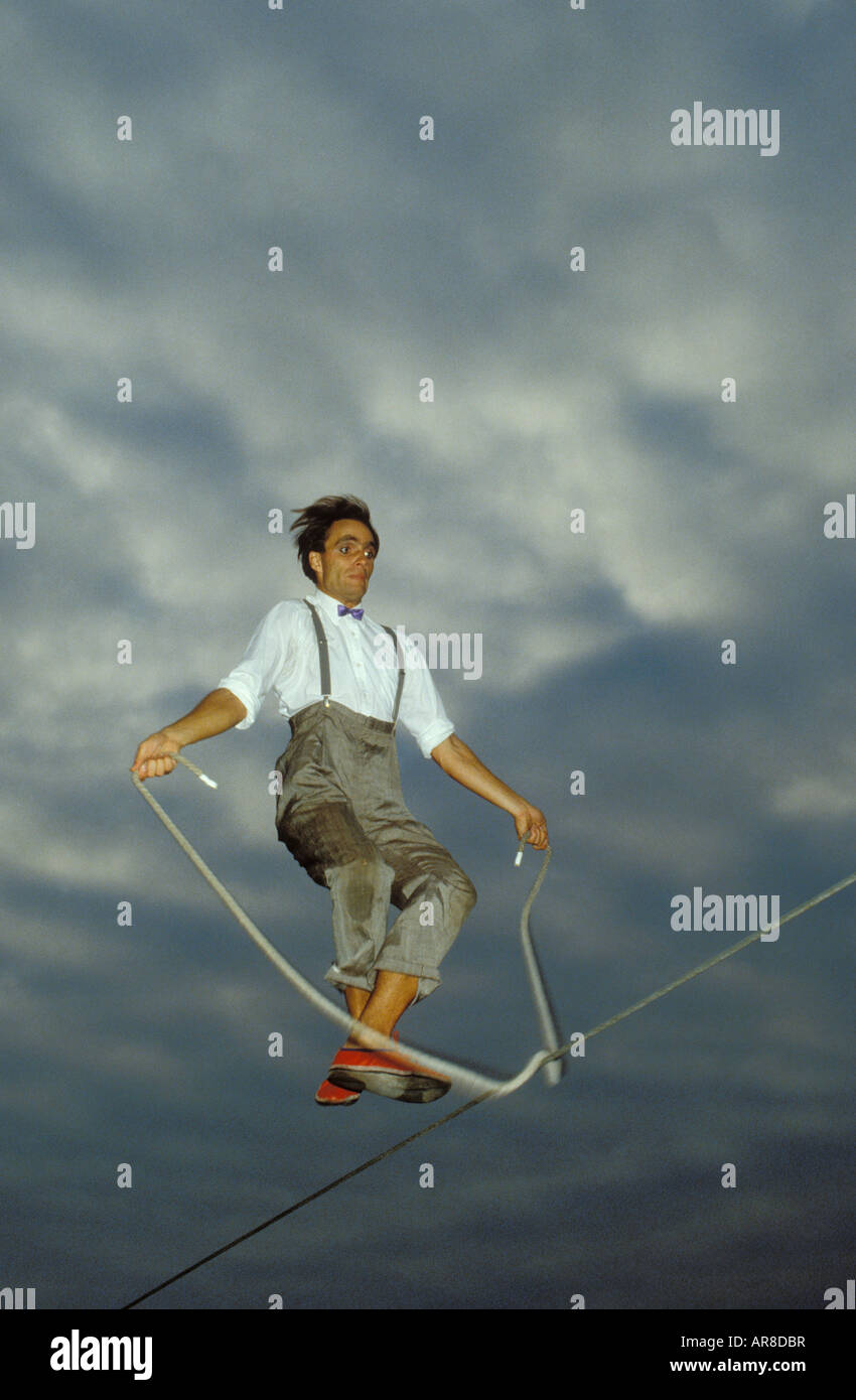 Rope dancer. Skipping. Man jumping with a rope on a rope Stock Photo