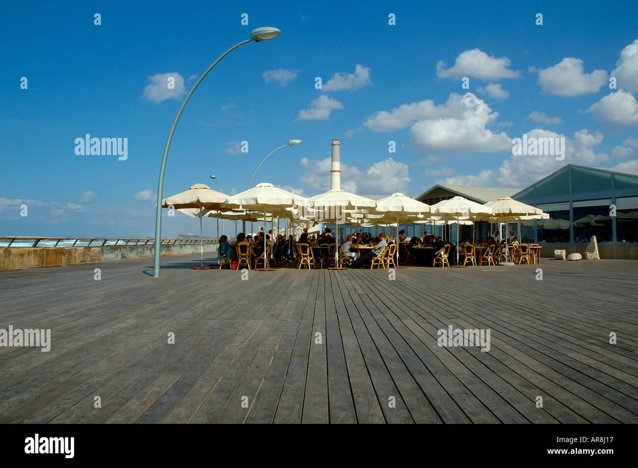 The seacoast promenade made of Brazilian wood Tabebuia chrysotricha at the old Tel Aviv seaport Israel Stock Photo