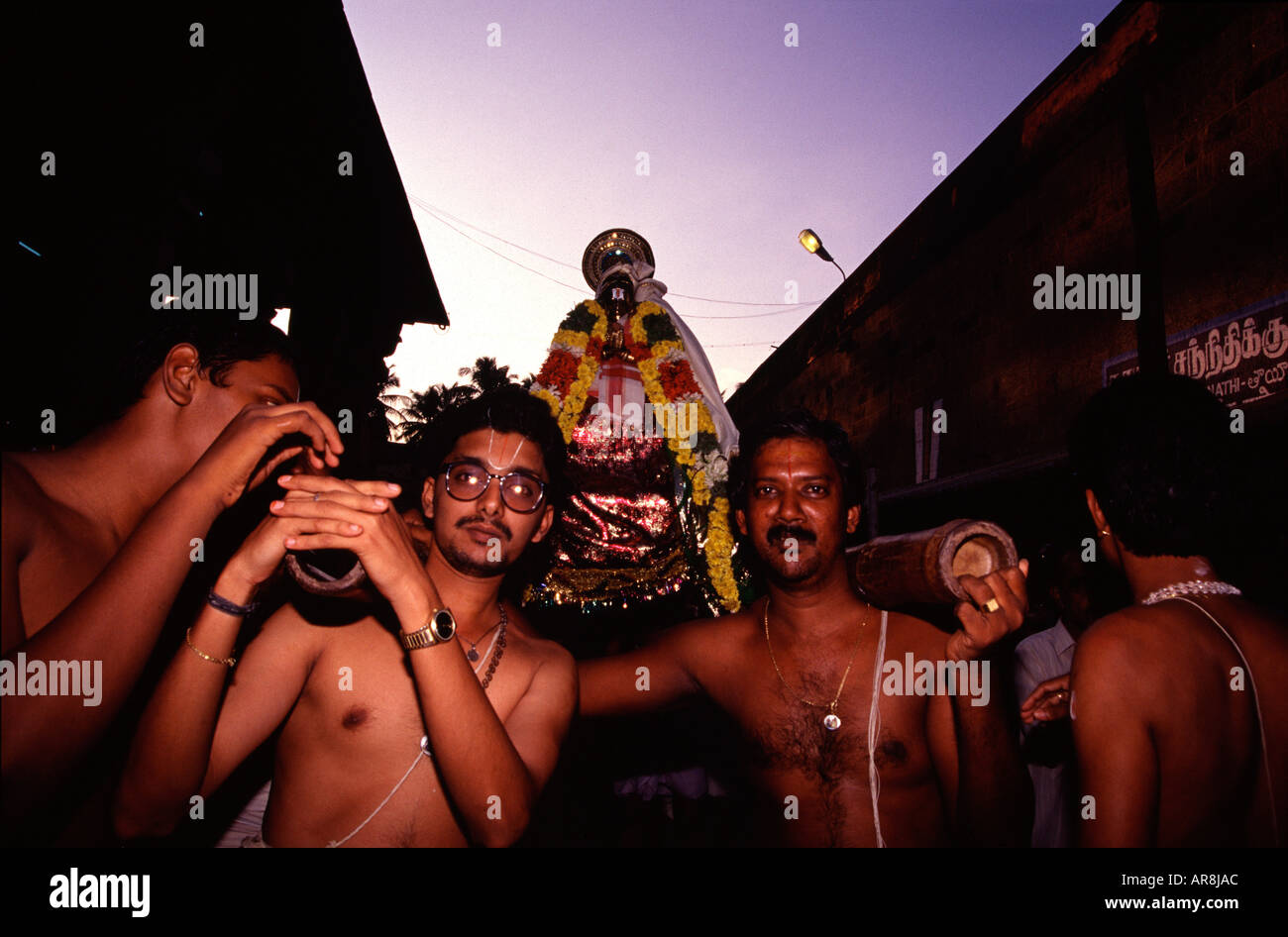 Hindu Brahmins carrying Nataraja deity during a Puja or Poojan ceremony in Nataraja Temple in the town of Chidambaram in Tamil Nadu state South India Stock Photo