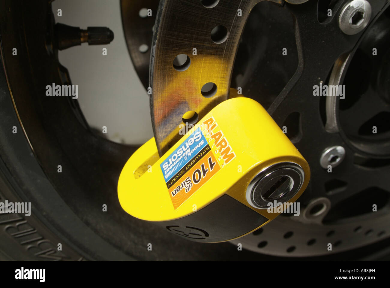 brake disk lock on a motorbike wheel Stock Photo Alamy