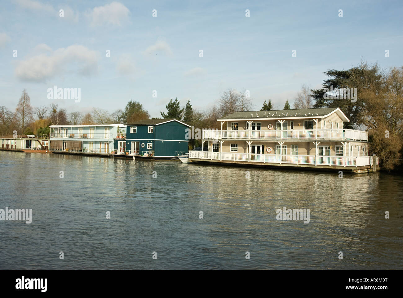 Large expensive 2 storey houseboats on river Thames Stock Photo