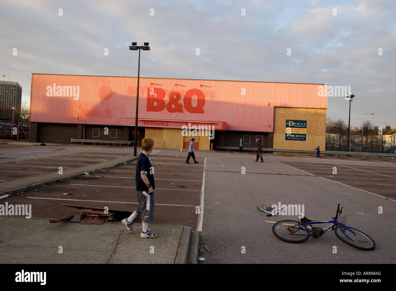 Disused B And Q Bandq B Q With Children Using Car Park As Football Disused B And Q Bandq B Q With Children Using Car Park As Football