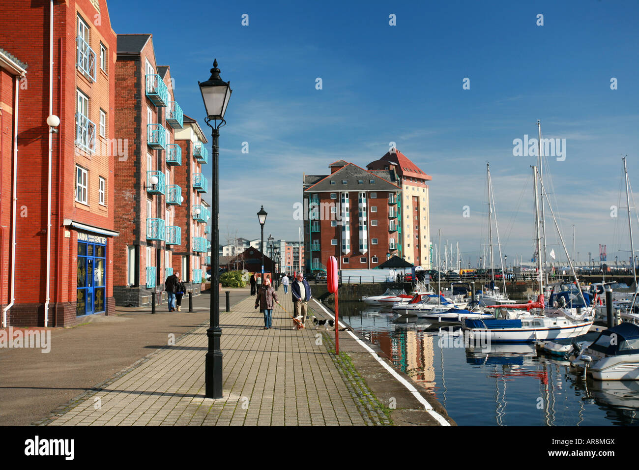 Swansea harbour side housing development with boats moored in Swansea