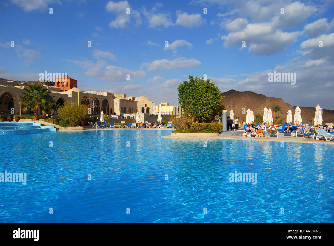 Swimming pool and loungers, Three Corners El Wekala Golf Resort, Taba Heights, Sinai Peninsula, Republic of Egypt Stock Photo