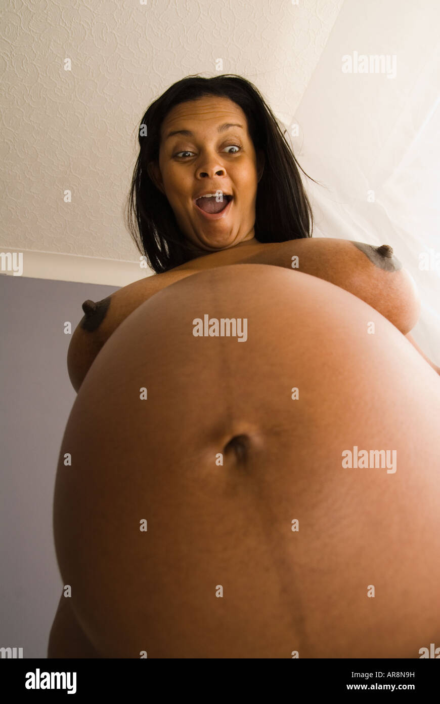 Pregnant naked black woman Stock Photo: Alamy