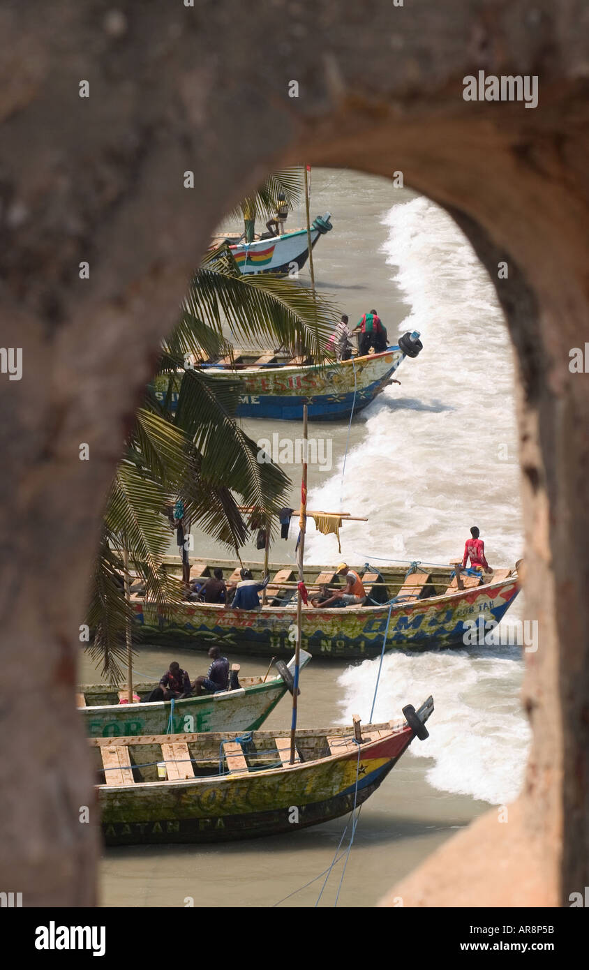Fishing boats on beach seen through fort window Stock Photo