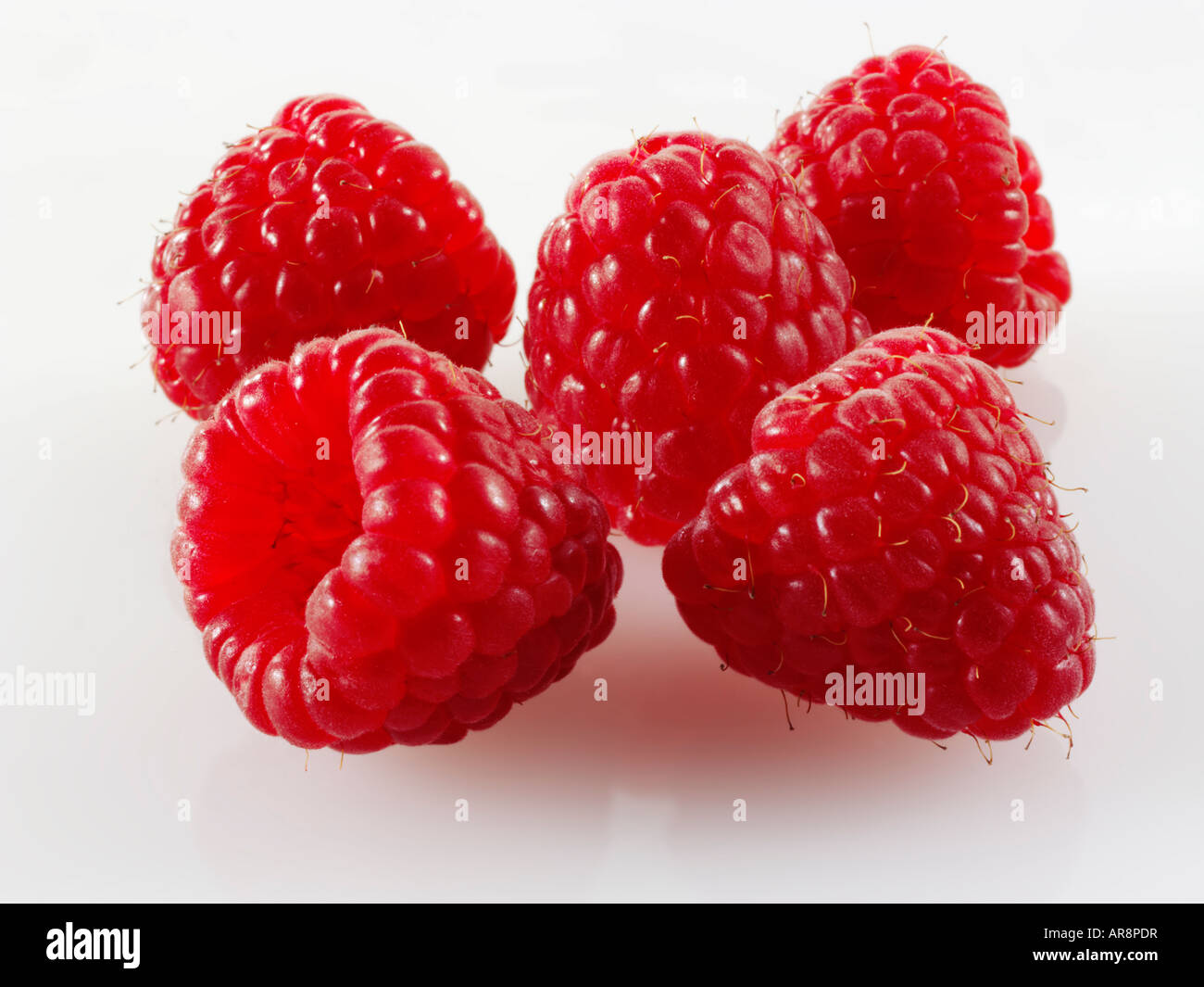 Organic  fresh Raspberries on a white background Stock Photo