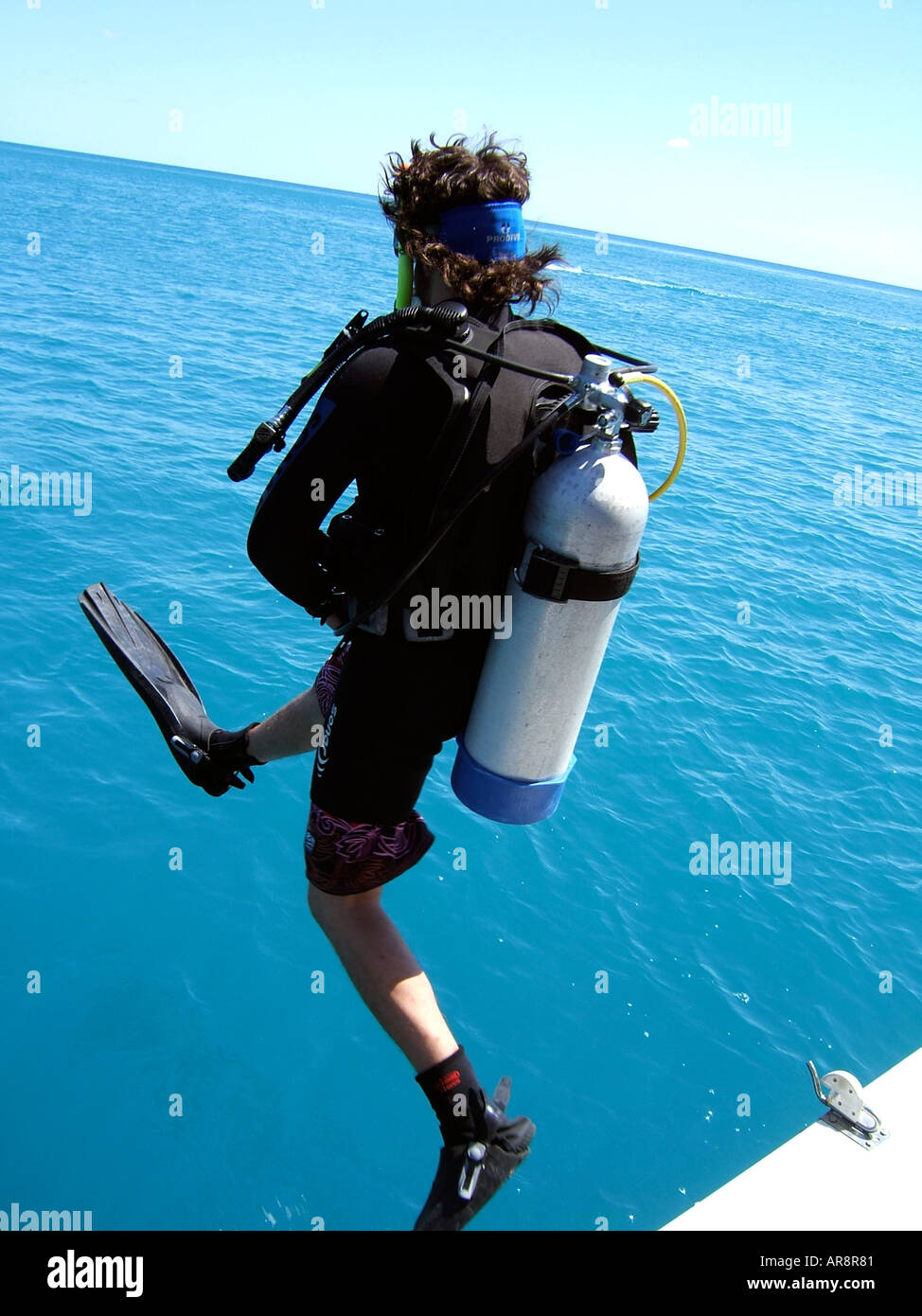 Scuba diver jumping into water hires stock photography and images Alamy