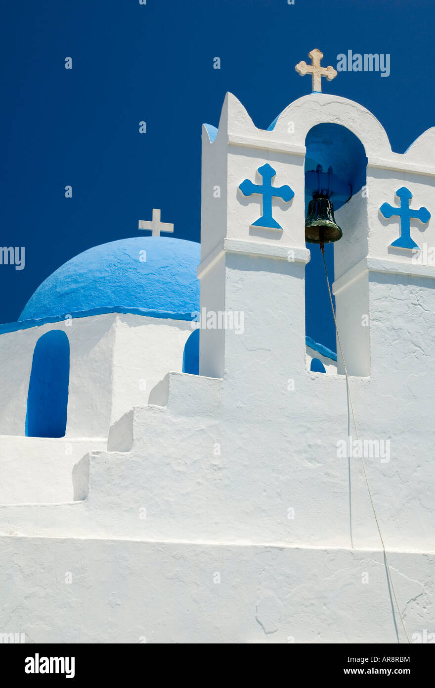 A traditional Greek scene of a blue and white Orthodox Church and bell tower in Parikia on the island of Paros, Greece Stock Photo