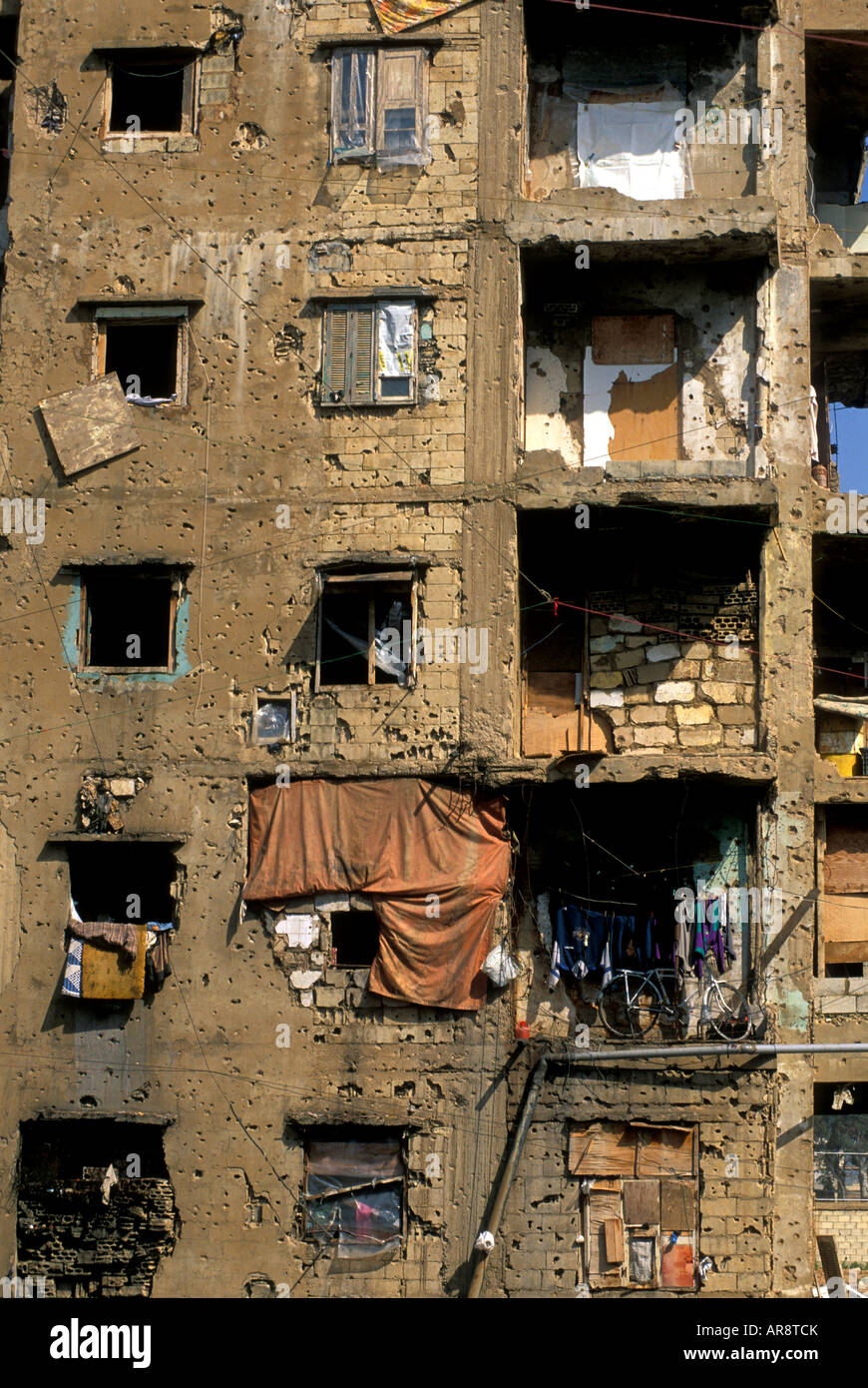 Damaged building by civil war time and poor families living, Beirut