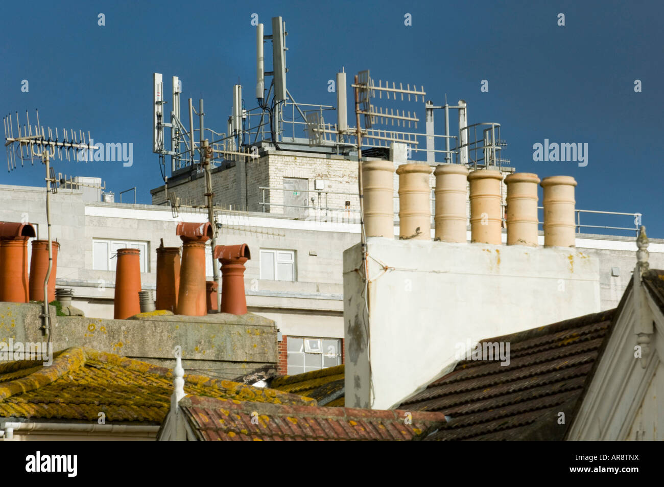 Mobile phone masts on the roof of a building in Western Road Brighton UK Stock Photo