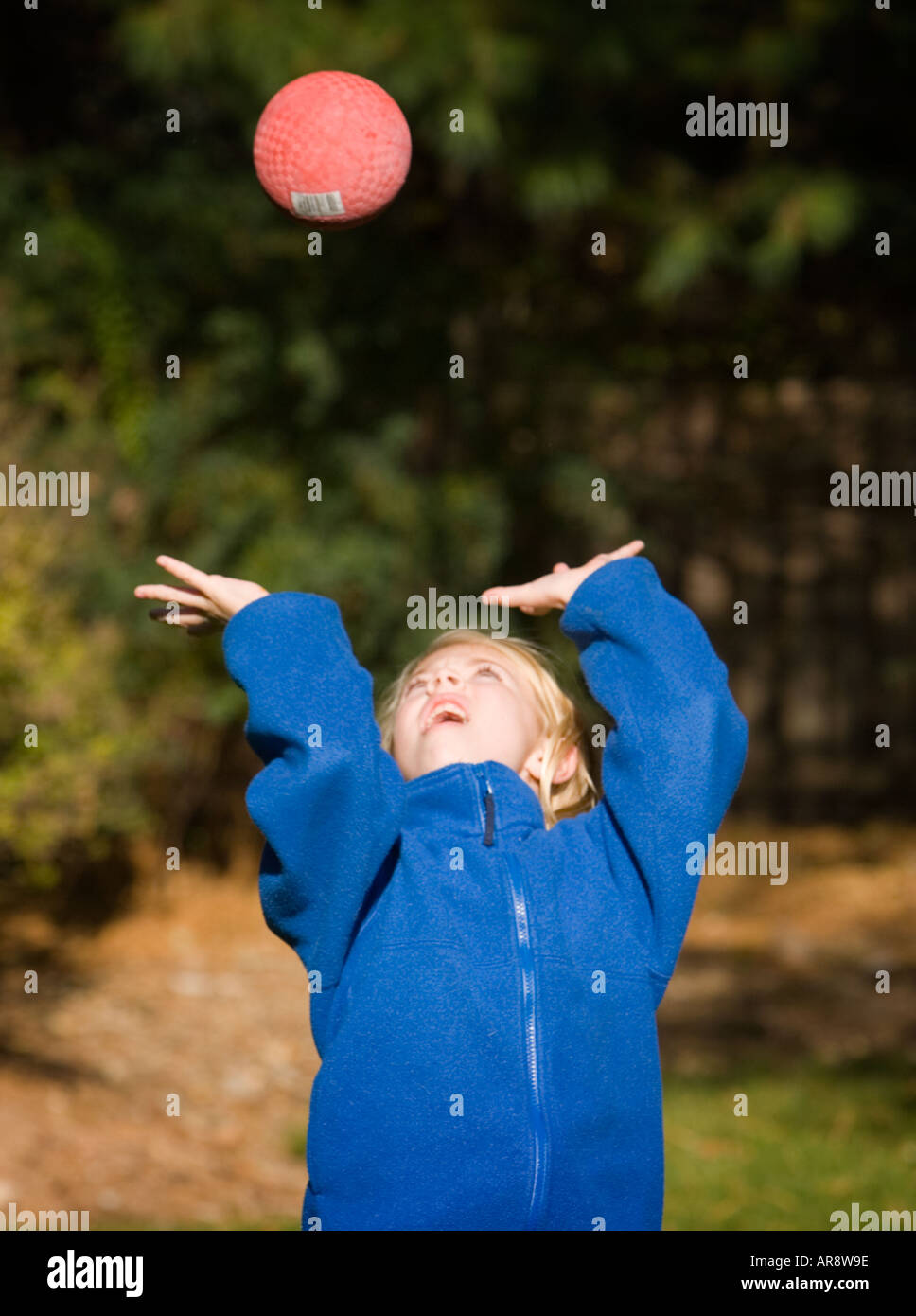 Child throwing a ball Stock Photo Alamy