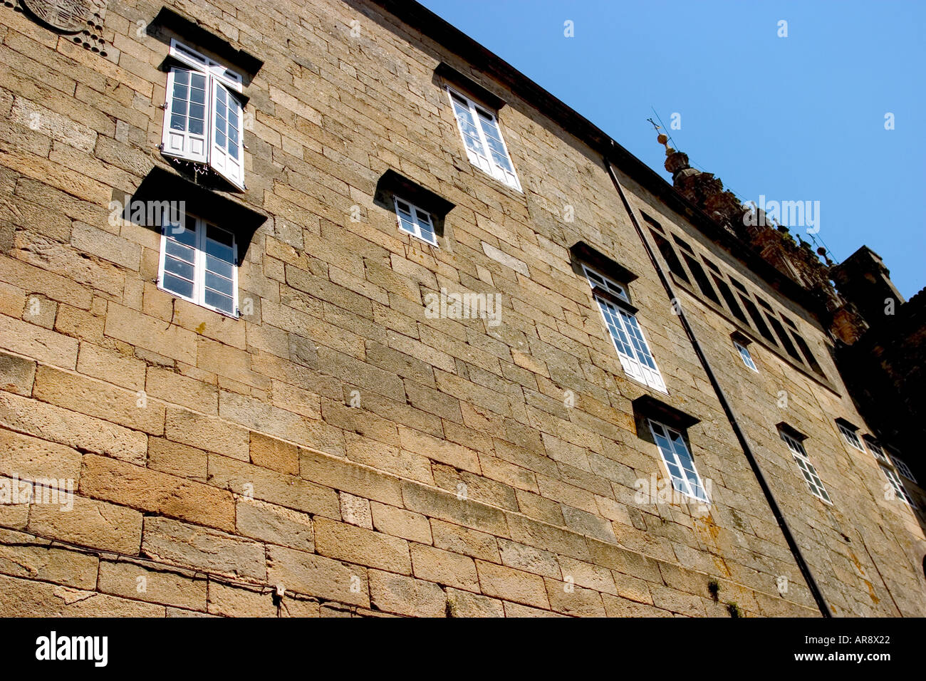 old wall house with rock Stock Photo - Alamy