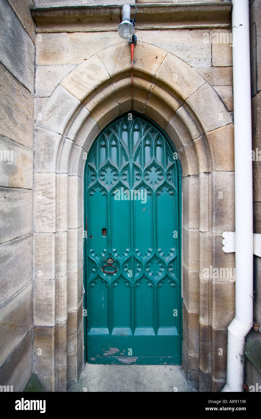 Ornate green rear entrance door to the Leeds Parish Church in Leeds