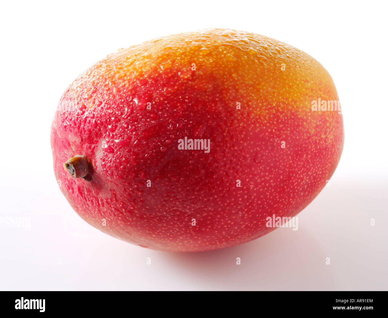 Fresh whole Mango against a white background for cut out Stock Photo