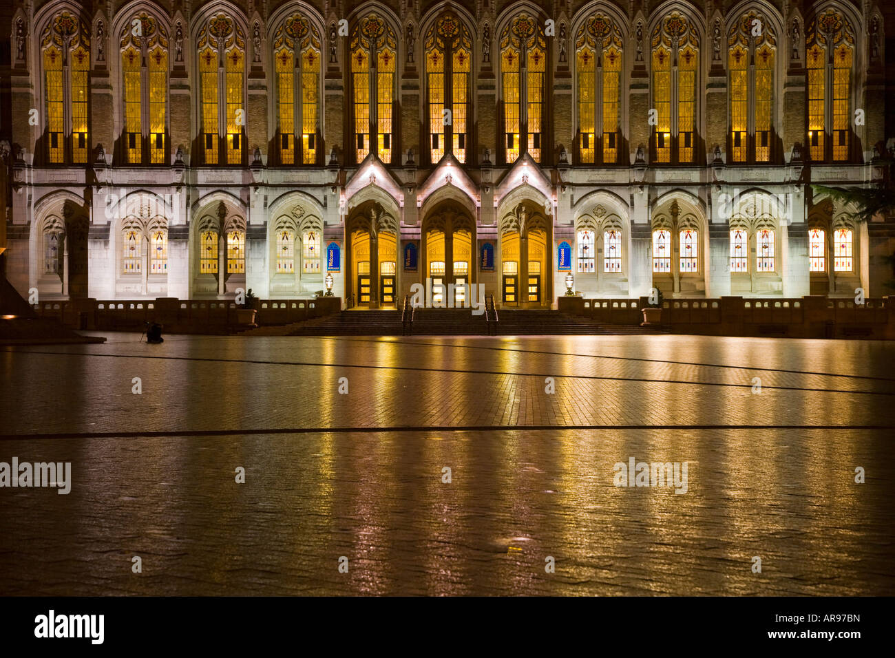 Suzzallo Library at night with rain reflecting from wet bricks of Red Square University of Washington Seattle Washington Stock Photo