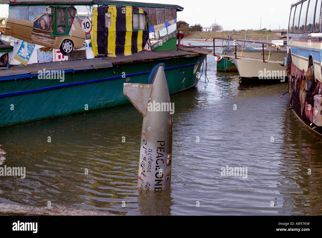Missile in river amongst artistic houseboats Stock Photo