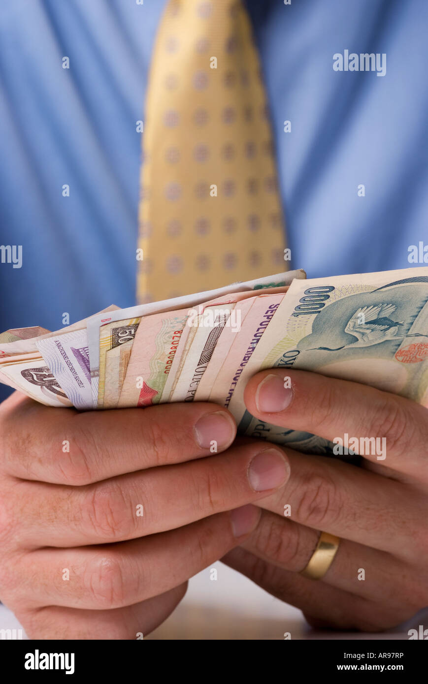 Close Up Shot Of Business Man Holding Foreign Currency Bank Notes - 