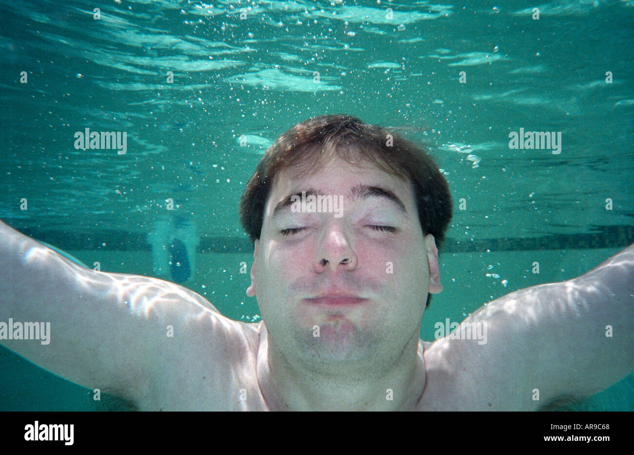 Man underwater holding his breath Stock Photo Alamy