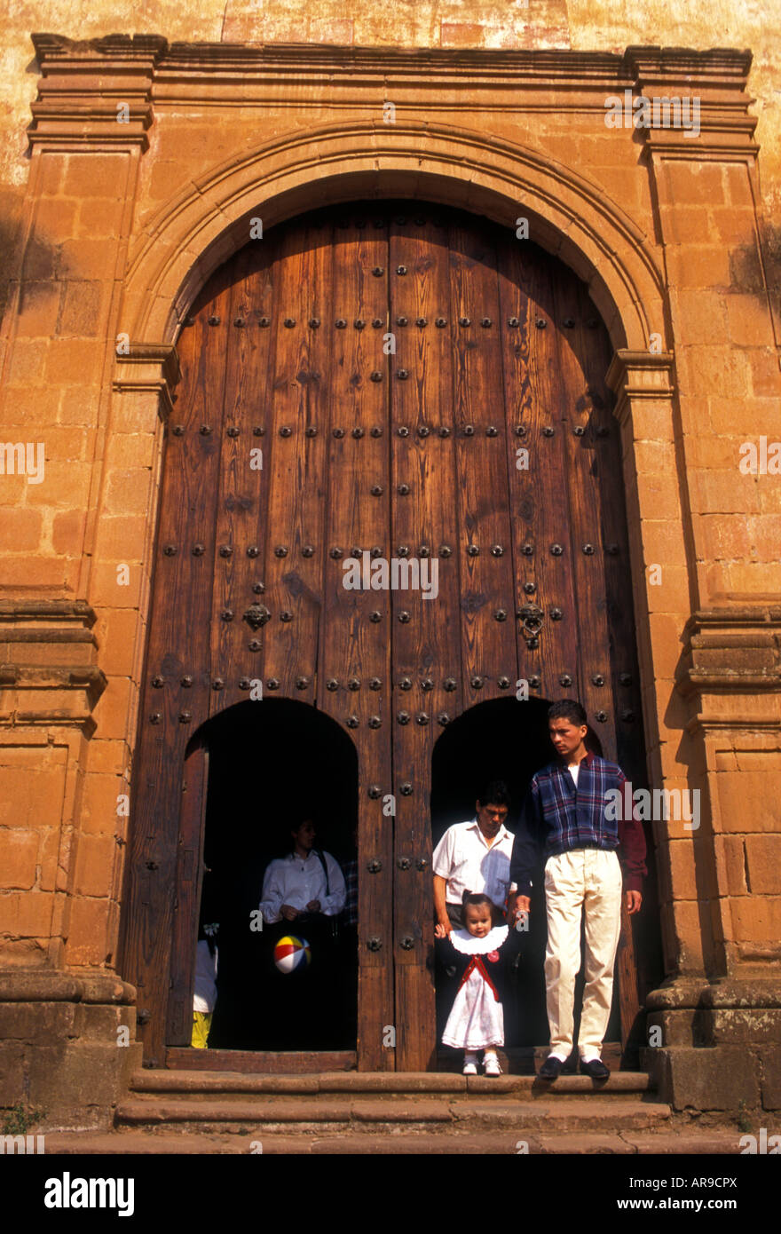 Mexicans, Mexican family, family, mother, father, daughter, tourists, visitors, La Compania Church, town of Patzcuaro, Michoacan State, Mexico Stock Photo