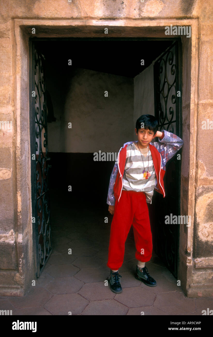 1, one, Mexican boy, eye contact, tourist, visiting, House of the Eleven Patios, La Casa de los Once Patios, Patzcuaro, Michoacan State, Mexico Stock Photo
